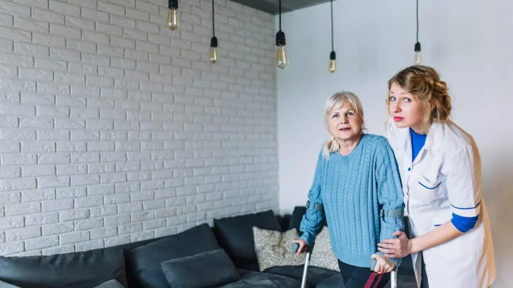 a community support worker helping an elderly citizen