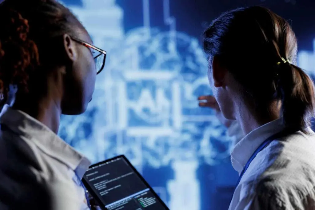 a woman is talking another about cybersecurity jobs in B.C.