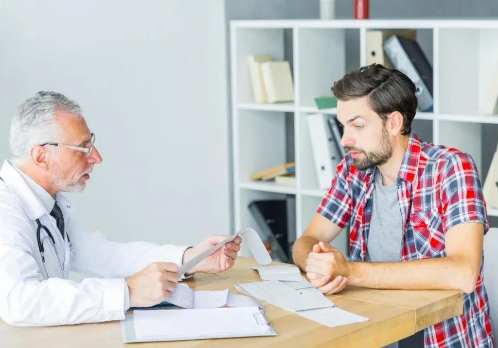 a man talking to a doctor on men's health month