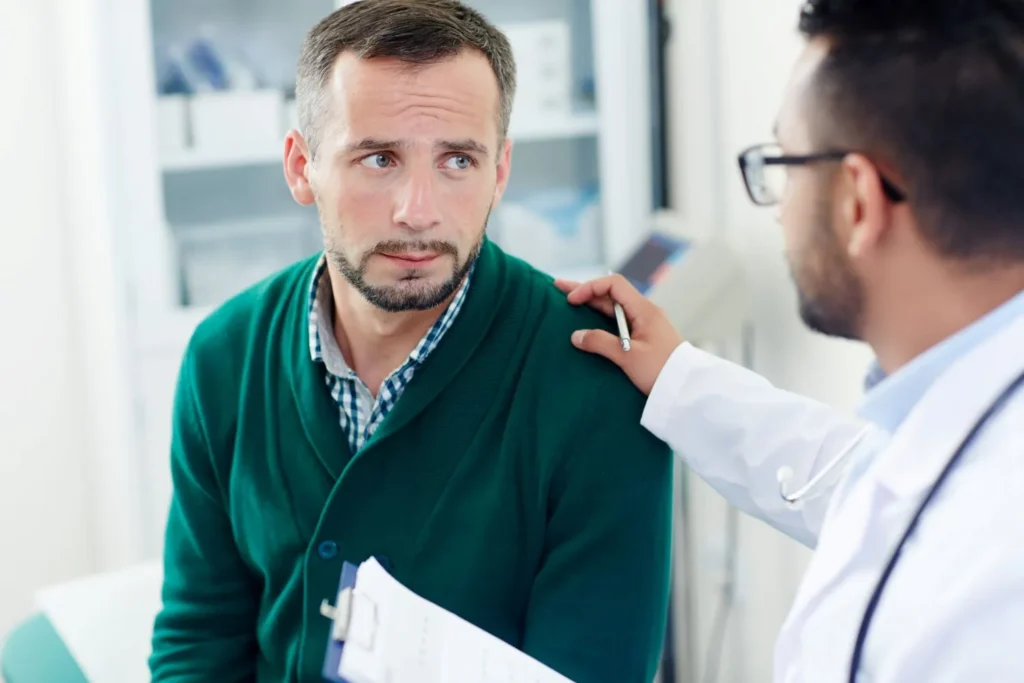 a man talking to a doctor on men's health month