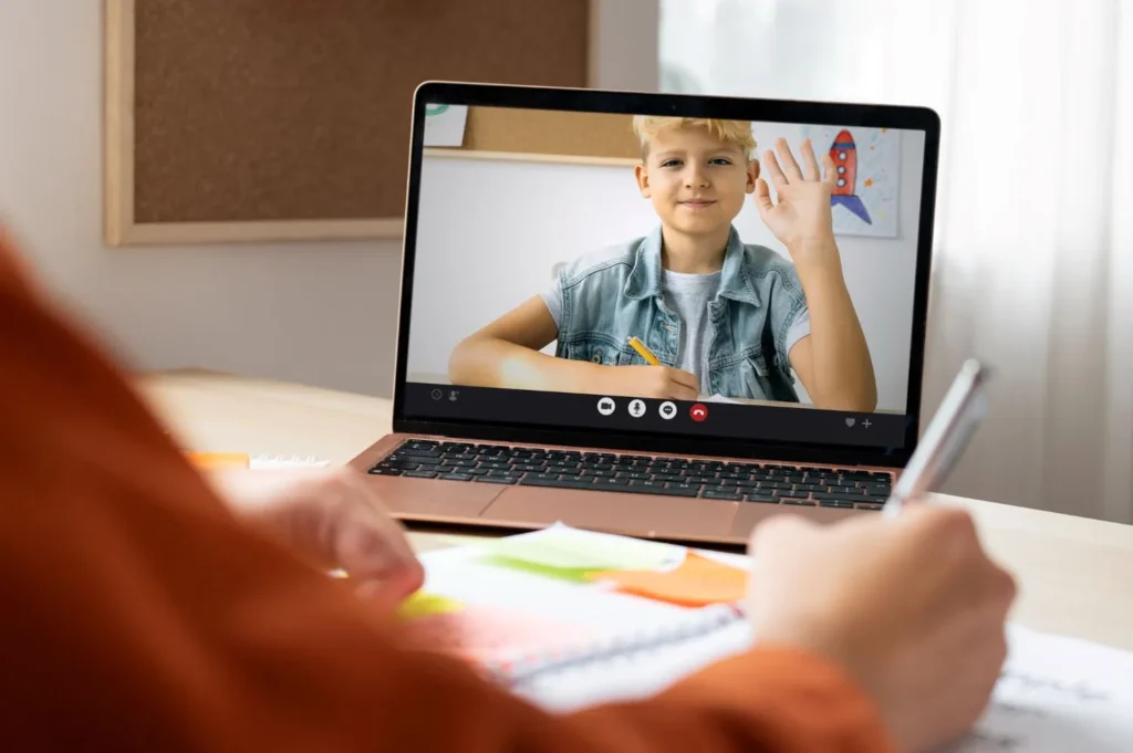 a boy is engaged in online learning
