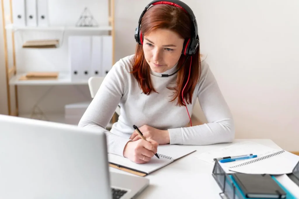 a girl is engaged in online learning