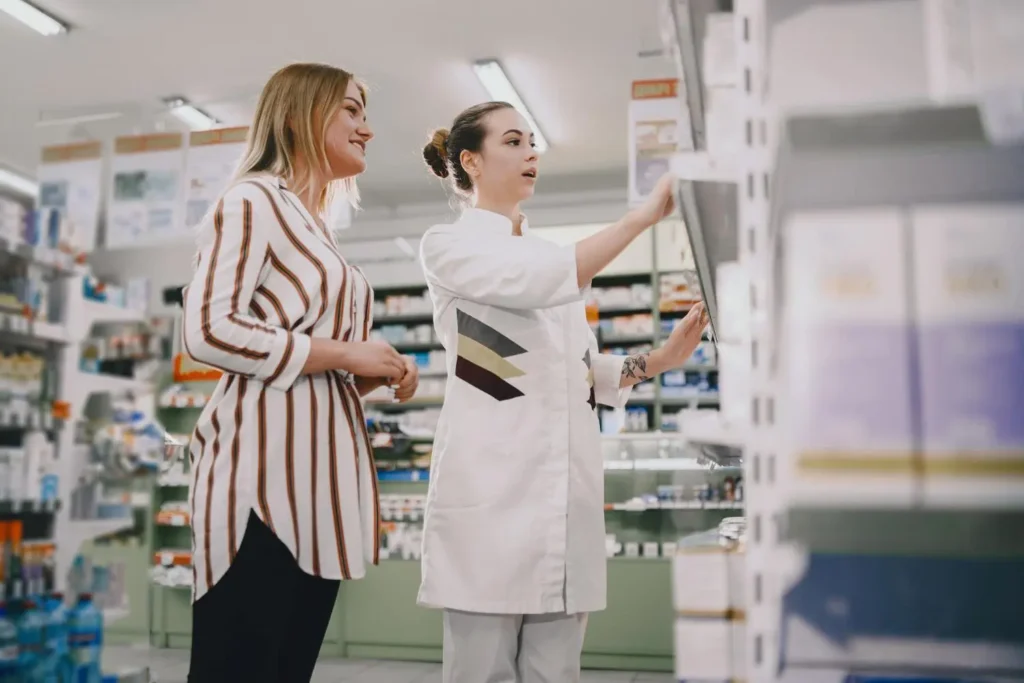two pharmacy assistants working in a drugstore