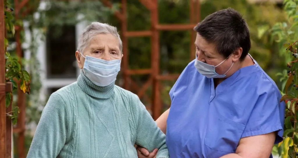 community support workers helping a patient