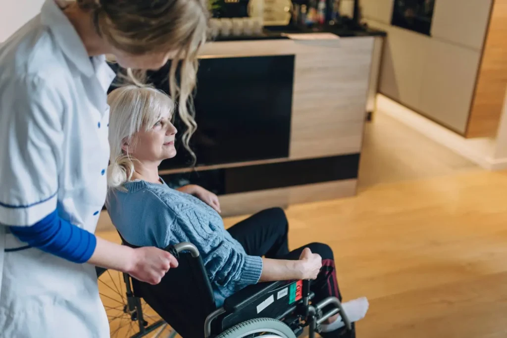 community support workers helping a patient