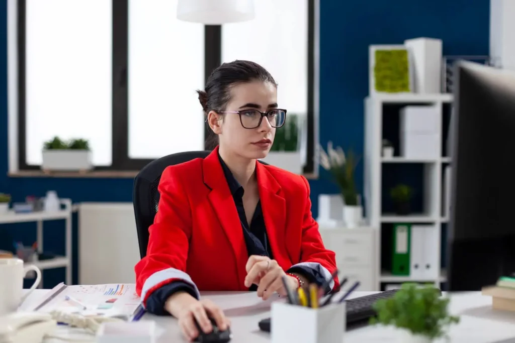 a woman with a business administration diploma working in an office