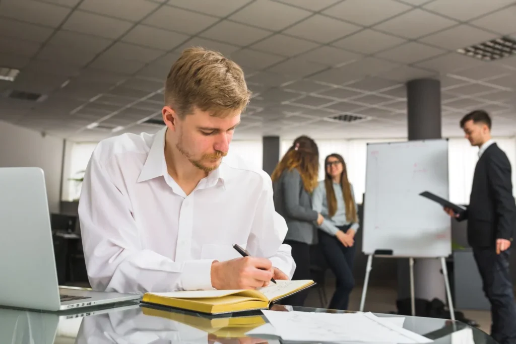 a man with a business administration diploma working in an office