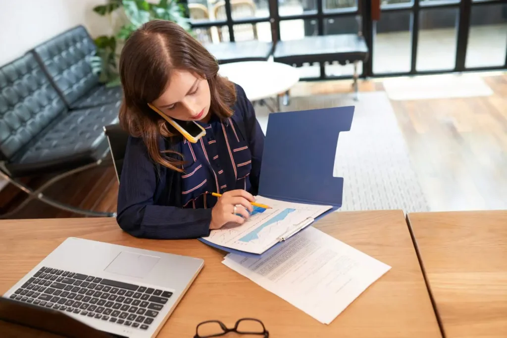 a woman with a business administration diploma working in an office